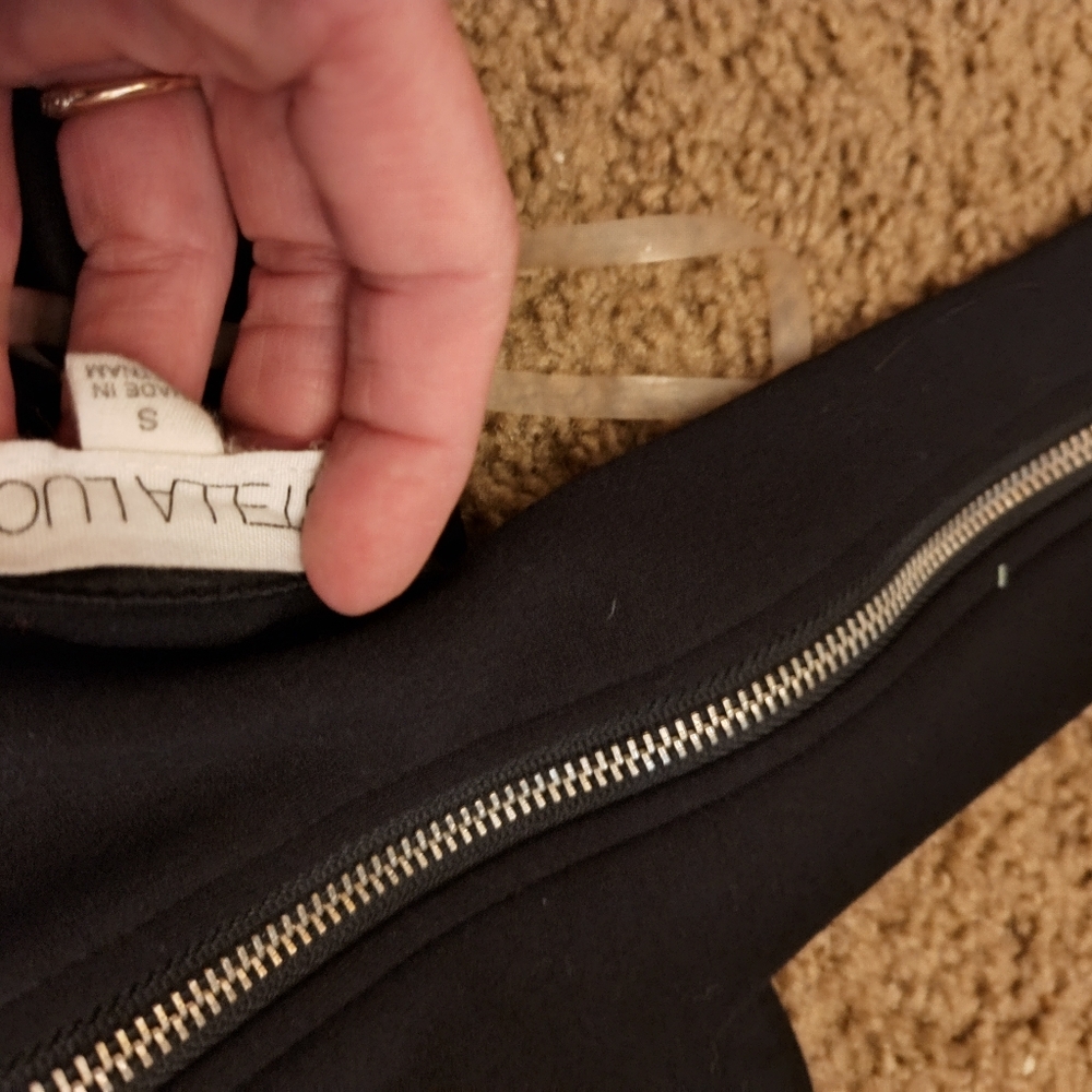 Black long pant backless romper. Very top wraps around your neck. Size s